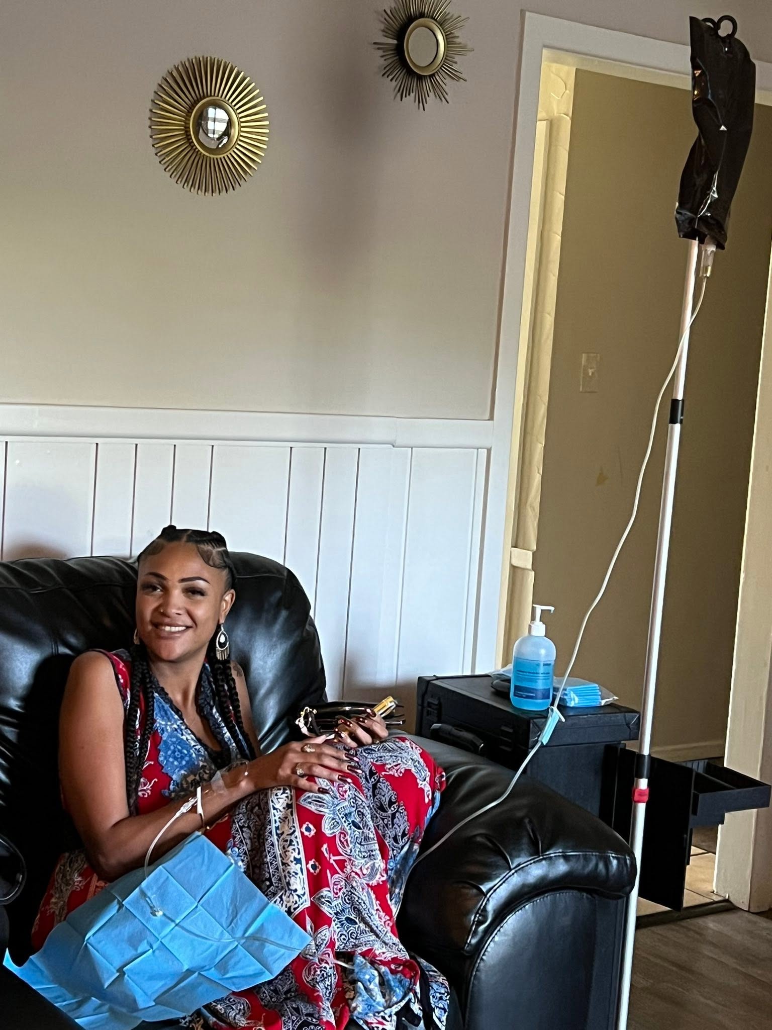 A Viva La Vie client relaxing during a mobile IV drip at home